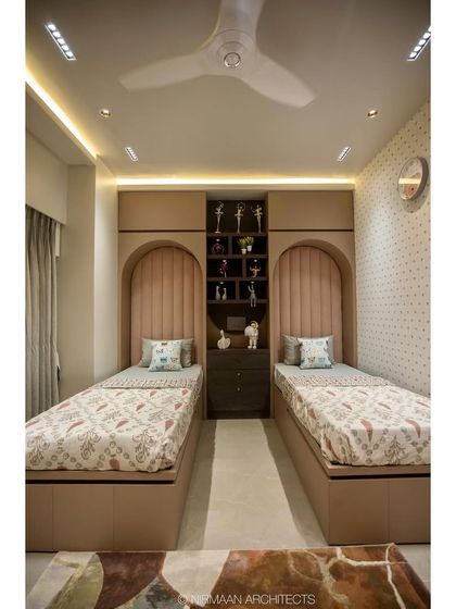 A full view of the shared daughters' bedroom in the Duplex Project. The symmetrical layout, soft lighting, and plush rug create a cozy and balanced space for two.