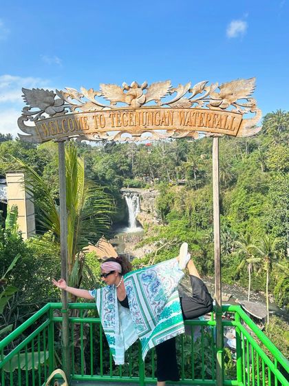 Finding a moment to strike a yoga pose at the beautiful Tegenungan Waterfall. Practicing yoga in such powerful natural spots helps to cleanse your energy and fill you with positivity.