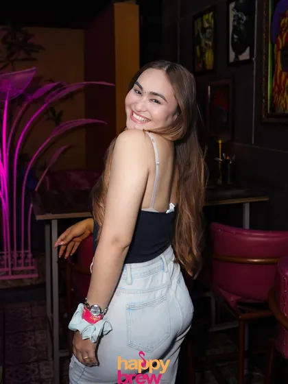 A guest enjoying the party from her seat. You can have a great time whether you're on the dance floor or chilling at a table.
