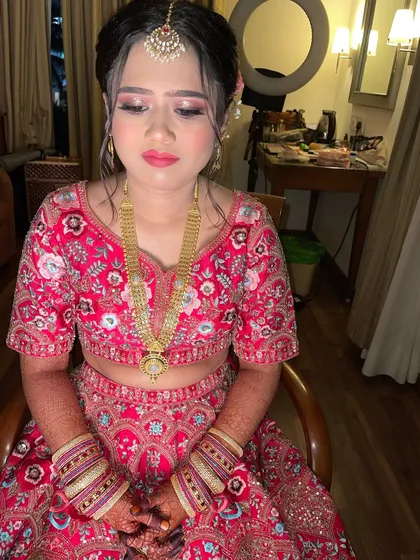 A candid shot of my beautiful bride in the makeup chair. The ring light in the background is one of the essential tools for creating a flawless look.