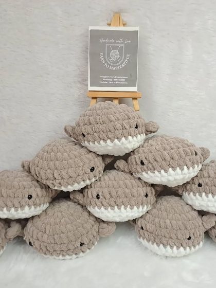 A collection of plush whale toys, perfect for birthday return gifts.