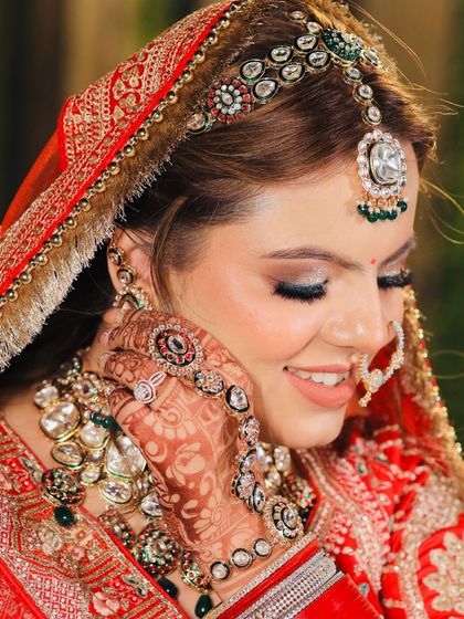 A close-up of my bride's happy smile, showing off the detailed eye makeup and radiant skin.