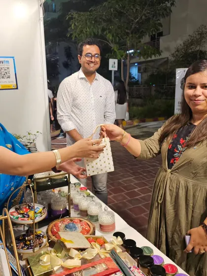Sharing a moment with a customer. Even after your purchase, I'm here to ensure your experience is filled with joy, just like the delightful aroma of my candles.