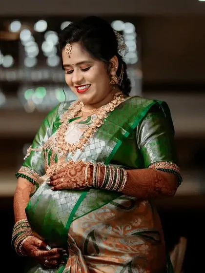 This candid photo captures the genuine happiness of the expecting mother as she enjoys her baby shower festivities.