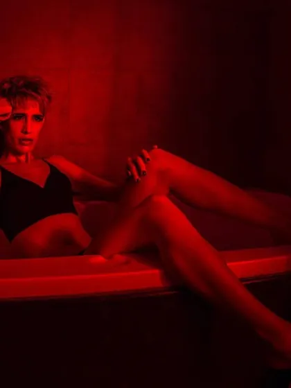 My background in fashion photography informs every frame. Here, I used intense red lighting to sculpt a scene, creating a powerful, moody portrait that tells a story without a single word. This is the level of artistic detail I bring to my music video direction.
