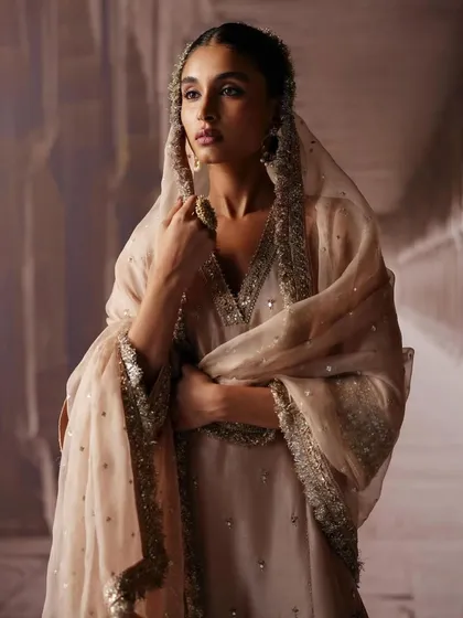 A soft and elegant look from the AR by Rhea Kapoor shoot. The muted color palette and delicate embroidery are perfect for a bride who loves minimalism.