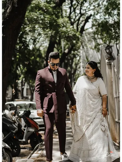 A stylish shot of the couple walking down the street after their ring ceremony, looking chic and happy.
