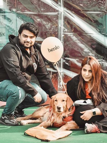 A family portrait at the pet fest. This couple and their lovely Golden Retriever show what these events are all about: community, love, and celebrating our furry family members.