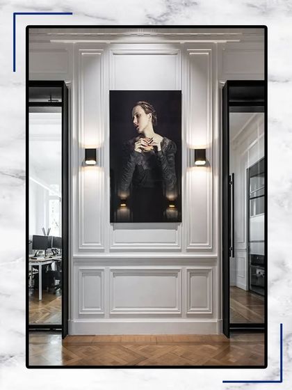 This image shows how our classic white wall paneling can serve as a dramatic backdrop for art. The combination of traditional architecture and modern decor creates a sophisticated, layered look.
