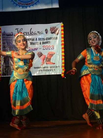 A joyful moment from a duet performance at the Jhenkara festival. The smiles on our students' faces show their love for the art.