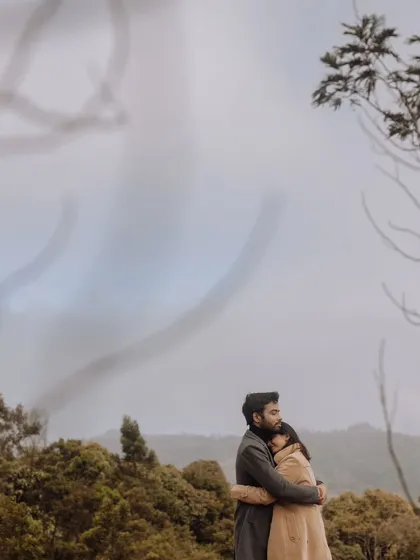 A soft and dreamy image of the couple embracing in a misty forest, creating an ethereal and deeply romantic atmosphere.