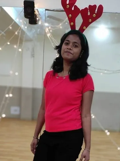 One of our students looking festive with reindeer antlers during our Christmas Eve session. We encourage everyone to dress up and have fun.