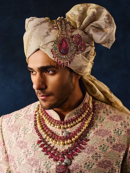 Men's jewellery requires a different kind of narrative. For this campaign, I focused on the sharp details of the ruby-studded sarpech and the layered necklaces, using lighting that highlights the groom's strong features and the richness of the pieces.