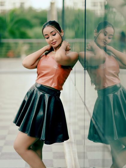 Another shot from the reflection series, capturing a moment of connection with the camera.