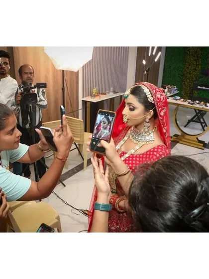 Our students are always eager to capture every detail. Here they are taking photos and videos during a live demo to study the techniques later.