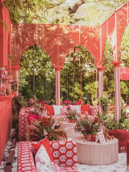 An immersive lounge experience at the "Red Affair," where the walls, seating, and decor are all unified by a rich, warm red palette, creating a passionate and energetic vibe.