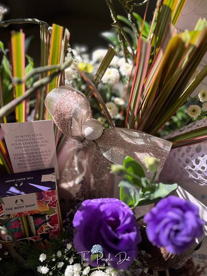 Here, a premium wellness product from The Body Shop is paired with a personal note and vibrant florals. This shows how I curate gifts that blend well-known luxury brands with bespoke, personal touches.