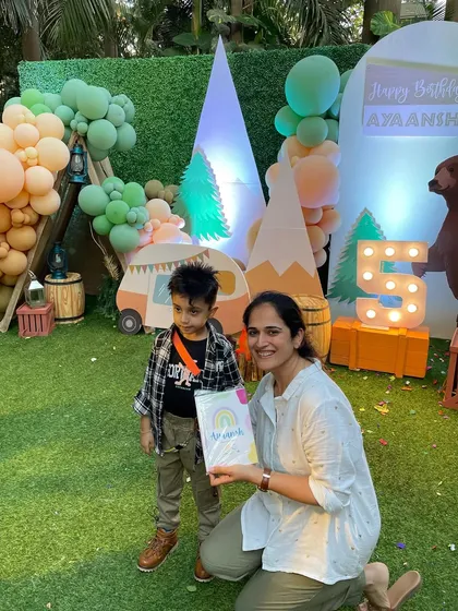 A snapshot with the birthday boy at his wild and free jungle-themed party. These little ones are so precious.