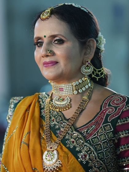 My jewellery is not just for brides. Here, the mother of the bride looks elegant in a layered Kundan set rented for the wedding festivities.