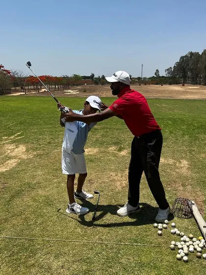 When new young players join, we focus on laying a strong foundation. Here, a coach works with a talented 9-year-old on his swing.