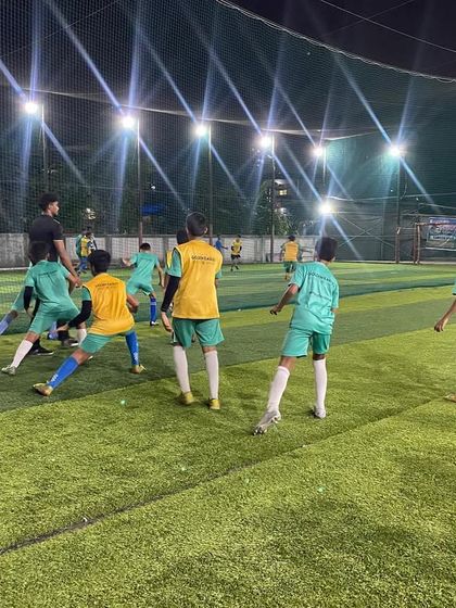 Players engaged in a dynamic warm-up exercise. Proper warm-ups are essential for performance and injury prevention, a key part of our training regimen.