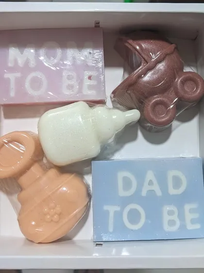 Celebrating new parents is so special. I created this baby shower gift set with new moms and dads in mind. It includes gentle, themed soaps like "Mom to be," "Dad to be," and other cute baby shapes.