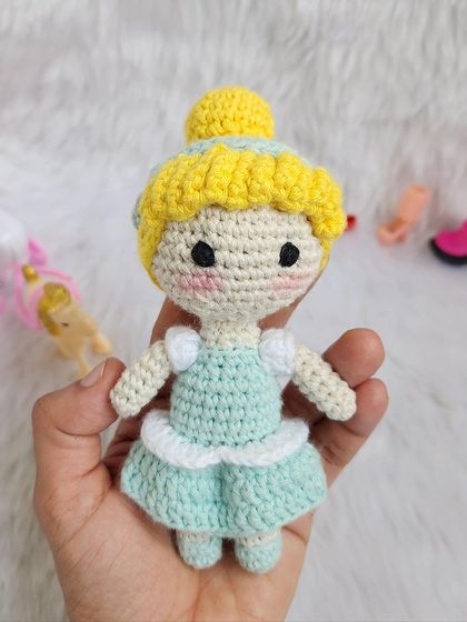 The classic Disney princess, Cinderella. She is dressed in her beautiful light blue ball gown with her hair in a neat bun, ready for the royal ball.