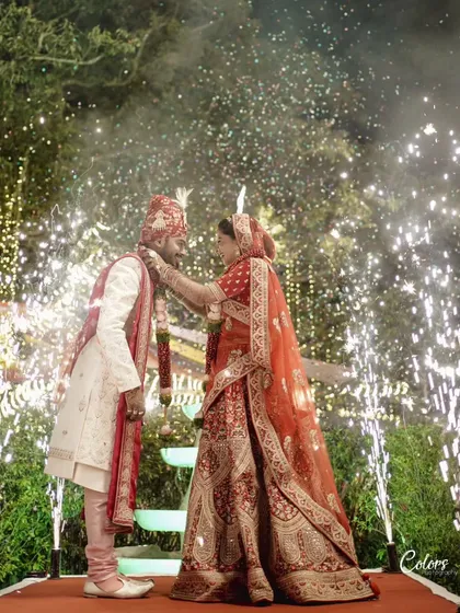 The Varmala ceremony, perfectly timed with a backdrop of cascading fireworks.