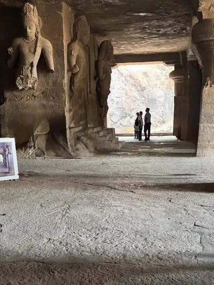 Holding the finished painting inside the Elephanta Caves. It was a privilege to paint at such a significant heritage site.