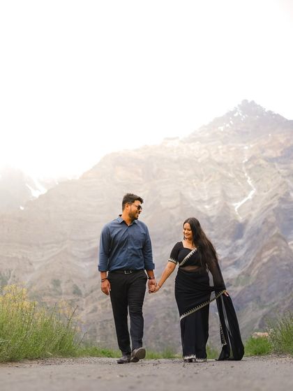 A quiet walk, hand in hand, with the majestic mountains of Baralacha Pass as your witness. This photo captures the simple, profound connection between two people.