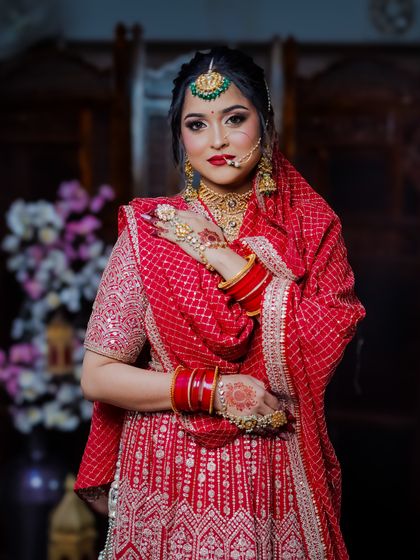 A classic three-quarter pose, showing off the beautiful silhouette of the bridal outfit.