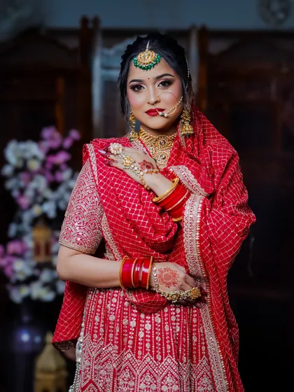 A classic three-quarter pose, showing off the beautiful silhouette of the bridal outfit.