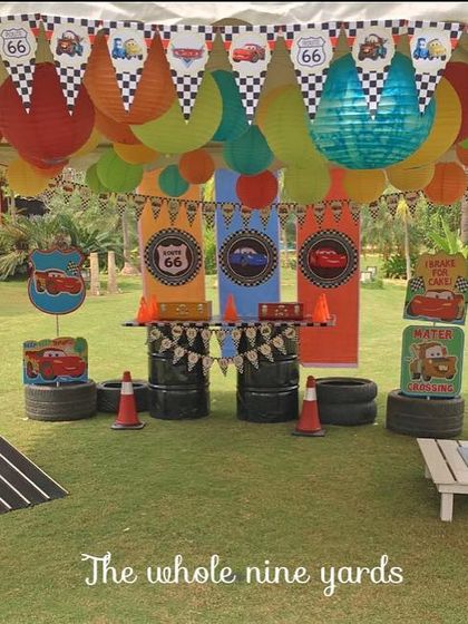 A "Cars" themed activity area. I set up a mini racetrack and other car-related games to keep the little racers entertained throughout the party.