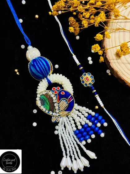 Celebrate the bond between your Bhaiya and Bhabhi with my coordinated Rakhi sets. This elegant peacock Lumba rakhi, paired with a matching thread for your brother, is a beautiful way to honor their relationship.