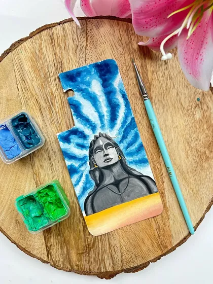 A close-up of the Adiyogi Shiva artwork before it's placed in a phone case. Painted with gouache, this design focuses on the meditative form of Shiva against a tie-dye style background, creating a piece of tranquil art for your device.