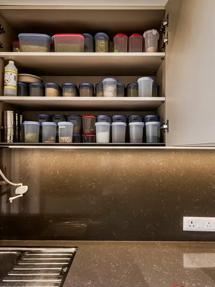 Well-organized upper cabinets for storing spices and dry goods, making them easy to find while cooking.