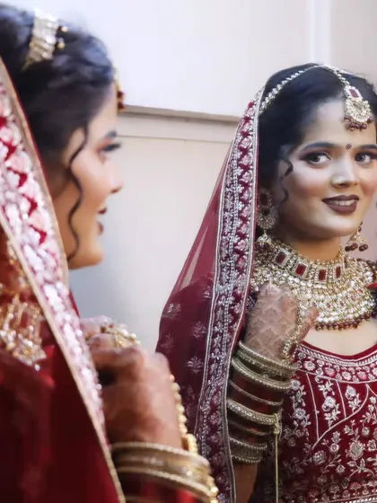 A mirror shot of the bride, reflecting on her beautiful transformation.