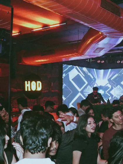 A wide shot of the scene at HOD, showing a full house dancing under the club's signature red lighting. My sets here are known for their relentless energy and mix of genres.