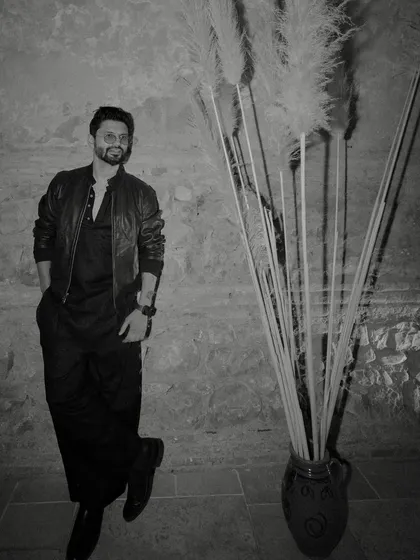 The same all-black look, captured in a classic black and white shot. This outfit is all about effortless style.