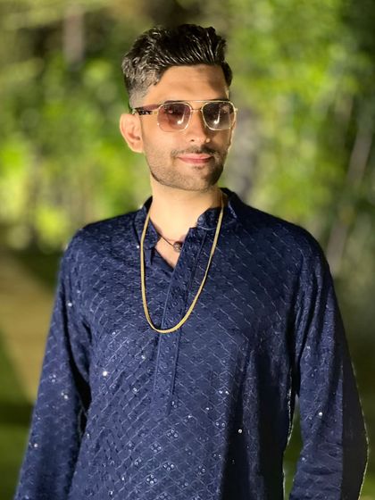 A candid shot in a classic blue kurta. Every wedding deserves its own magic, and I bring a unique vibe to each celebration.
