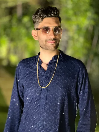 A candid shot in a classic blue kurta. Every wedding deserves its own magic, and I bring a unique vibe to each celebration.