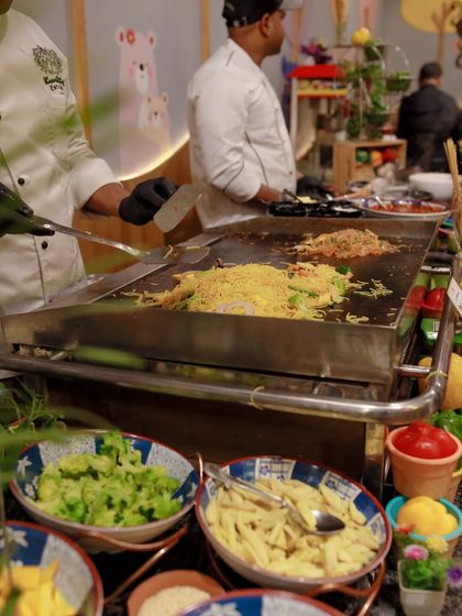 Our live noodle station is a fantastic option for parties. A chef prepares customized stir-fried noodles on a large teppanyaki-style grill, providing both a meal and entertainment.