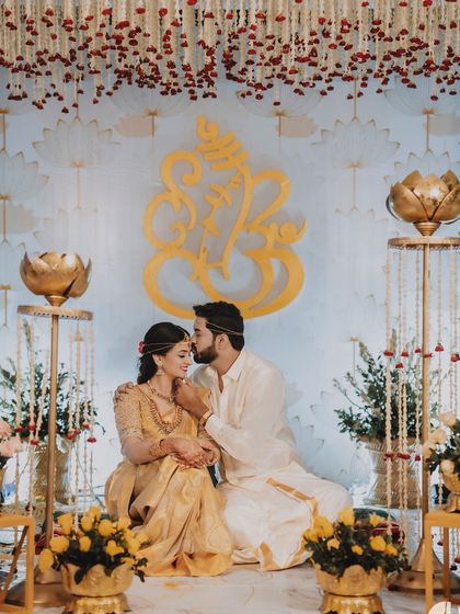 A collection of moments from bride Ishwarya's Muhurtham. Her golden wedding saree was draped to be both photogenic and practical for the various ceremonies of a traditional South Indian wedding.