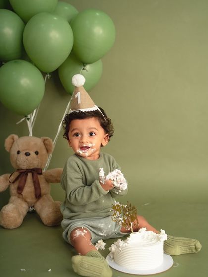 Covered in cake and absolutely loving it! The joy on his face is what makes cake smash sessions one of my favorite milestones to capture.