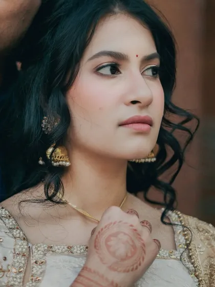 A close-up of Kavya's soft and glowy engagement look. The focus is on her flawless skin and the statement eyes that add a touch of drama to her otherwise minimal makeup.