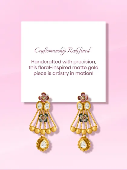 Grace in every curve, art in every detail. This floral-inspired matte gold earring is a masterpiece in motion, featuring enamel work and a polki drop, crafted to captivate.