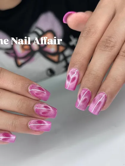 A vibrant pink cat eye effect with a subtle pattern, creating depth and a velvety finish.