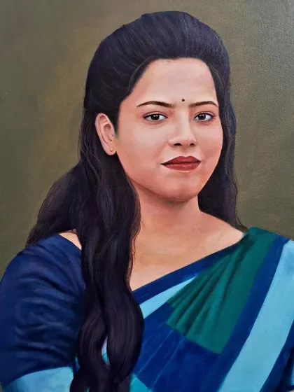 A close-up of the finished portrait, showcasing the fine details of her face and the texture of the saree. Capturing a subject's personality is a key objective of my portrait work.