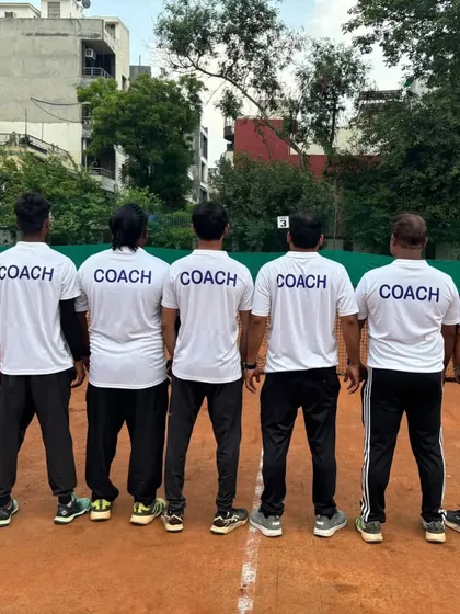 This is our team. We are a unit of dedicated coaches committed to building the next generation of tennis champions. We are on the court with our players, guiding every forehand, backhand, and serve.