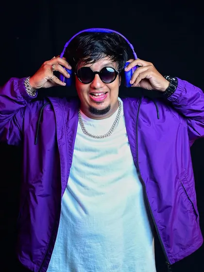 A colorful shot with headphones, reflecting my positive energy. I believe in succeeding against the odds and proving doubters wrong.